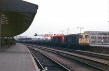 PHOTO  CLASS 20 20112 WITH A CLASSMATE PASSING GLOUCESTER STATION IN JUNE 1987