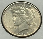 US 1934D Small D Peace Silver Dollar MS Uncirculated, Nice Goldish Toning KM 150