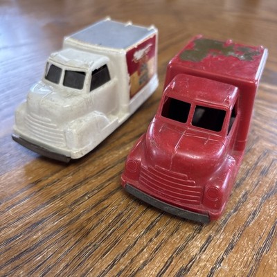 PAIR OF VINTAGE FRICTION TRUCKS CONWAY TOY CO. CARNATION MILK & FIRE TRUCK