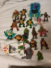 Vintage TMNT Toy Lot Of 14 Figures And Accessories along With An Old Case