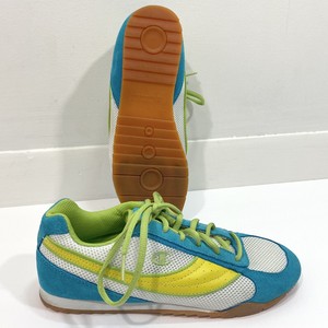 blue and yellow champion shoes