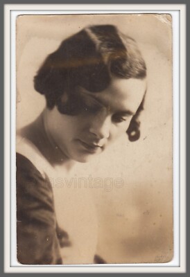 Pretty woman stylish girl doesn't look at camera Hair Soviet avant-garde photo