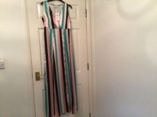 Ladies sleeveless striped maxi dress. Side zip. Long side split. V neck.  