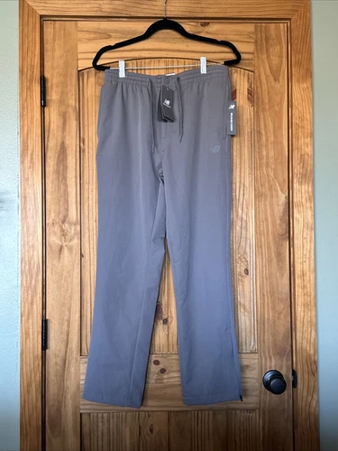 Pantaloni da pista New Balance uomo medi all motion foderati in pile grigio zip alla caviglia nuovi con etichette