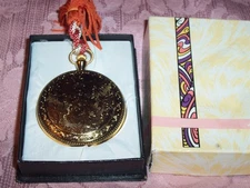 Gold Tone  MUSIC BOX GOLD COLOR ORNATE BACK IN BOX PLAYS SONG