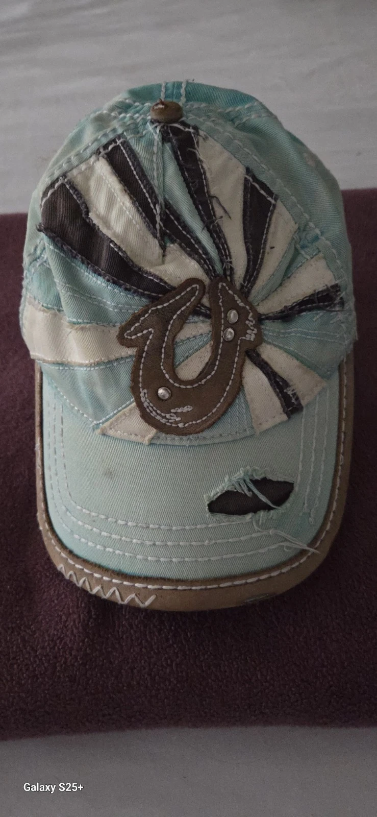 True RELIGION light turquoise with tan horseshoe and sun rays