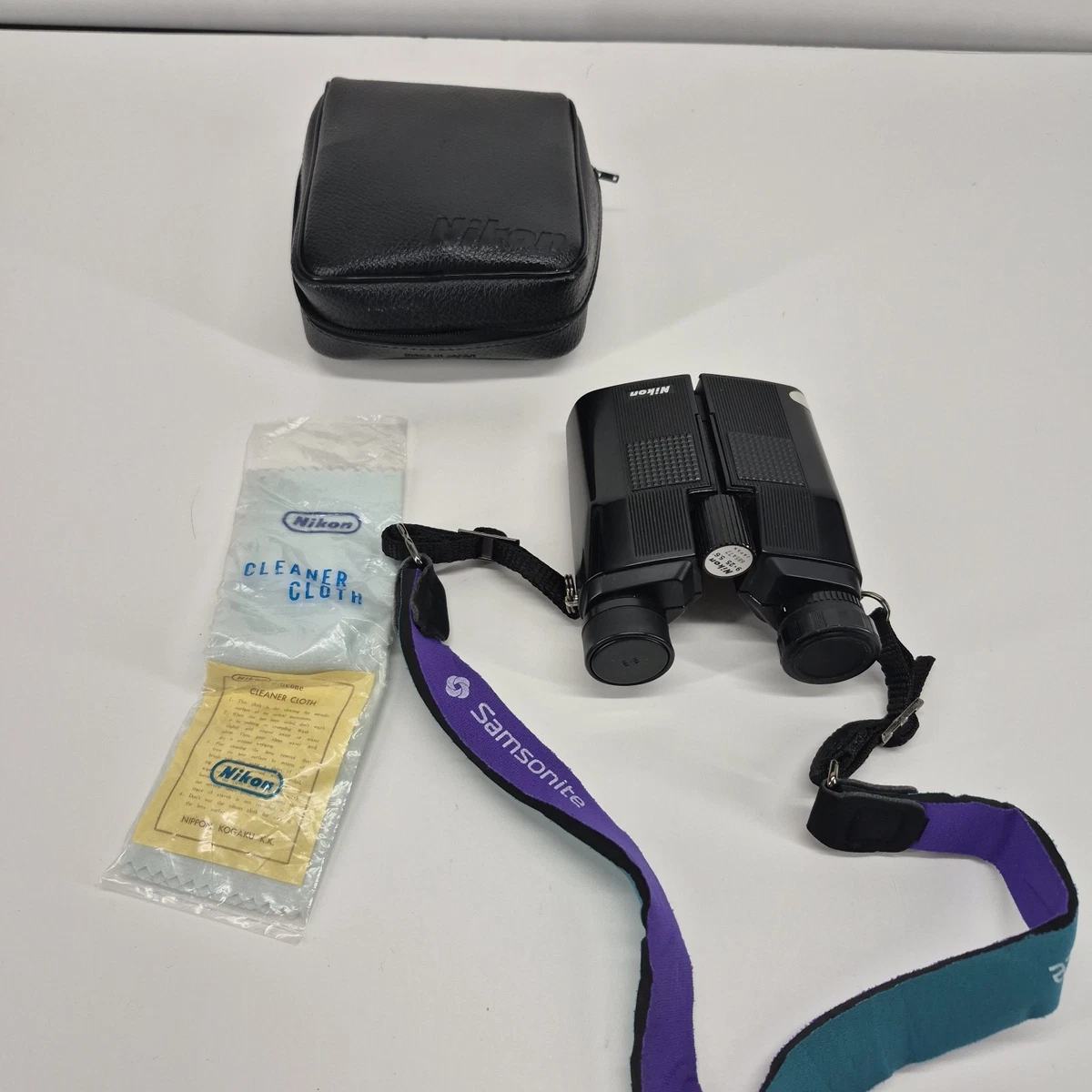 NIKON 9x25 Travelite 5.6° Compact Black Binoculars with Case