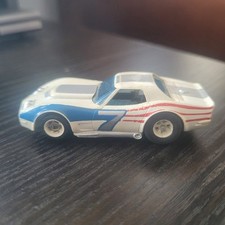 Vintage AURORA AFX RED WHITE BLUE 7 CORVETTE STINGRAY HO SLOT CAR DOESN'T WORK