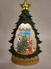 Family Decorating Christmas Tree Scene Holiday Illuminated Swirling Glitter Tree
