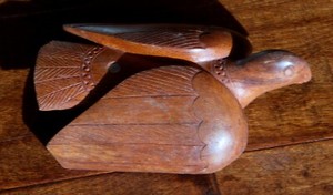 hand carved hard wood bird with inlaid pearl, Papua New Guinea, vintage