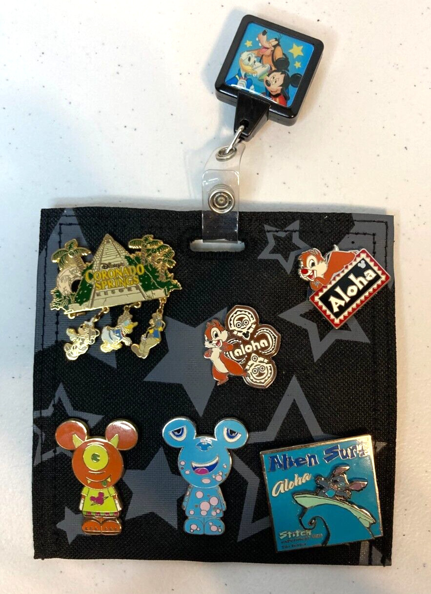 Authentic Disney Theme Parks pin set & Pin Holder on retractable holder 8 pcs.