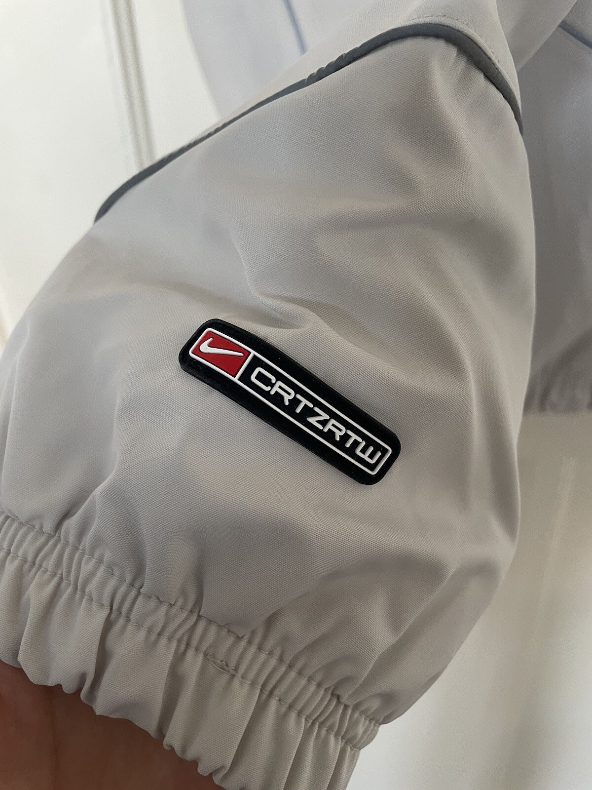 OFF WHITE X NIKE Giacca Nike x Corteiz NRG bianco sporco grigio riflettente