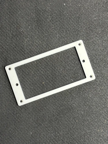 Flat, thin (2.5 mm), white Gibson Humbucker pickup ring.