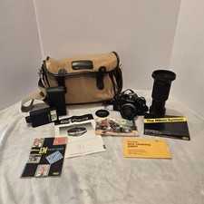 Nikon EM 35mm Film Camera w/Series E 50mm Lens Nikon Bag 70-210mm Lens Flash