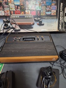 Atari 2600 Video Game Console With 2 Controllers,  Catalog & Damaged Box