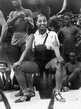 American born singer dancer Josephine Baker surrounded by male dan- Old Photo