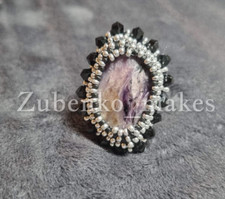 beautiful handmade ring with amethyst decorated with beads