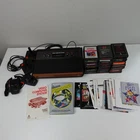 New ListingVintage Atari 2600 CX2600A Console Black Woodgrain W/ Games Manuals Controllers