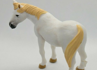 white plastic horse