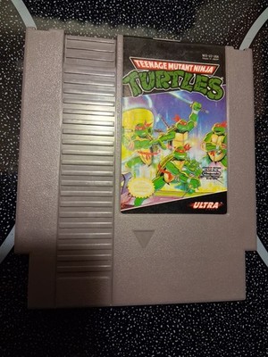 1985 NES Nintendo Teenage Mutant Ninja Turtles Video Game Cartridge and Booklet