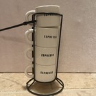 Four Espresso cups w/ metal rack to stack and organize the cups.