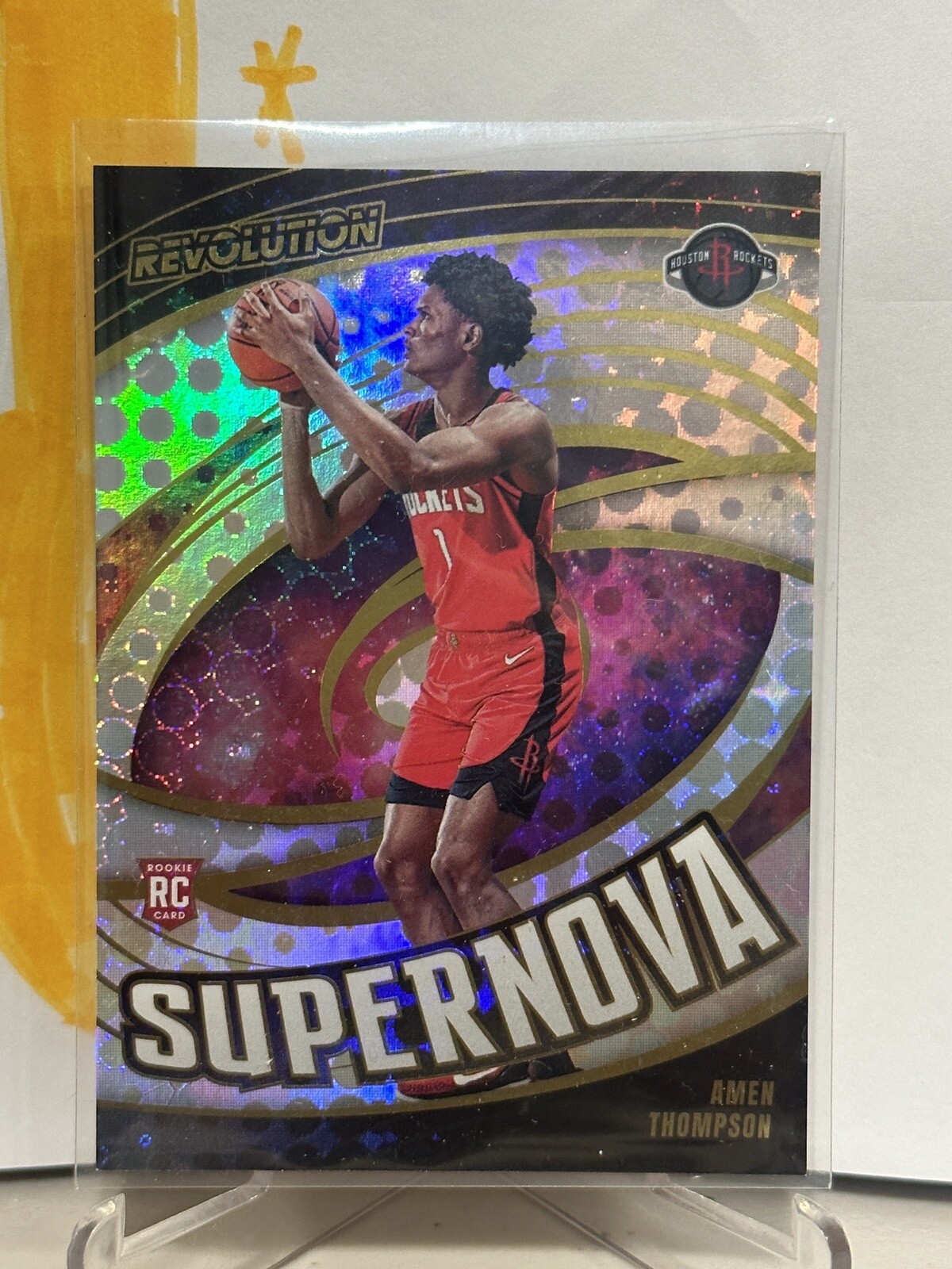 2023-24 Panini Revolution #7 Amen Thompson Supernova RC Houston Rockets