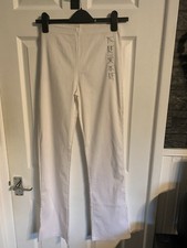 Ladies stretchy white leggings with silver embroidery size 10 - 12