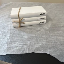 a decorative faux book stack designed for home decor with Fall Sweet Fall On It