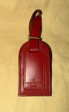 Authentic Louis Vuitton Small Red W Gold Hardware leather name tag.