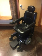 Used blue Invacare Pronto motorized wheelchair 3' 4" x 2' 9.5" x 3' 8"