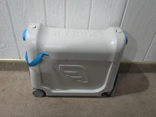 JetKids by Stokke BedBox Kid's Ride-On Rolling Suitcase Gray Clean W/bedding pad