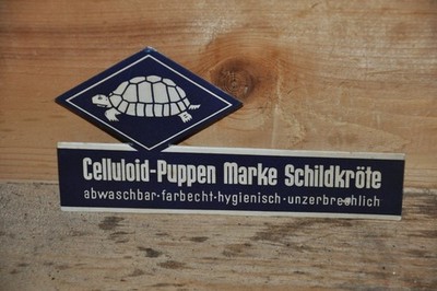 Altes Reklameschild 30er Jahre Celluloid-Puppen,Marke Schildkröte,Spielzeug