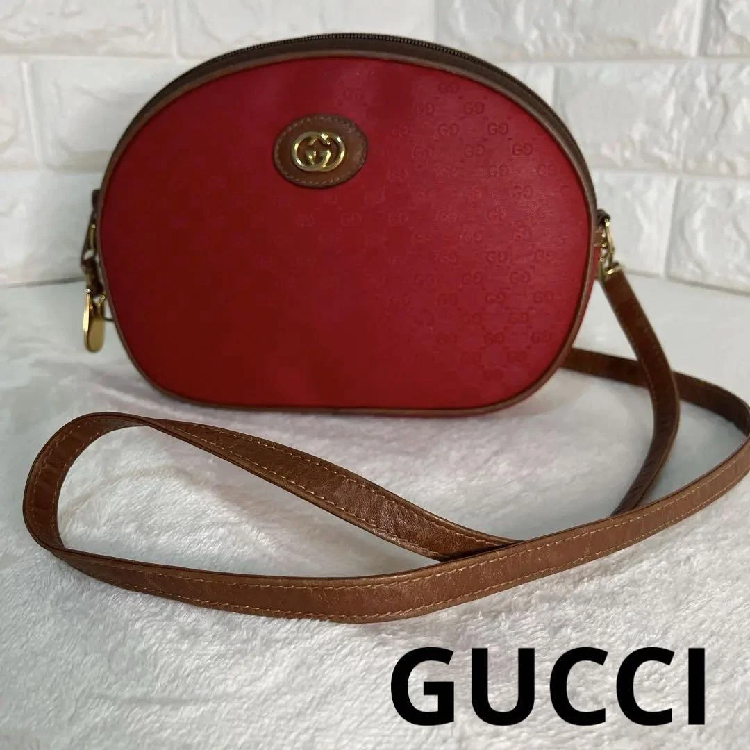 Gucci ancien sac à bandoulière GG cuir marron quincaillerie dorée femme 15,5x23 cm