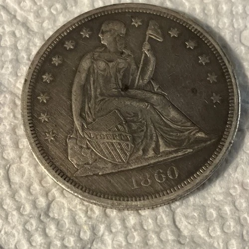 1860-P Seated Liberty Dollar — photo from the most recent tracked eBay sale