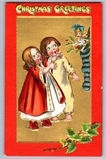 C.1910 CHRISTMAS GOLD 2 CHILDREN LOOKING AT DOLL IN STOCKING TUCK'S Postcard P46
