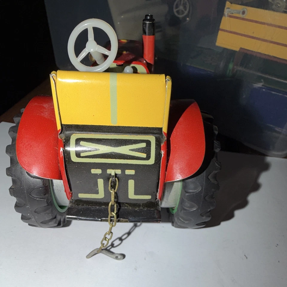 Blechspielzeug Traktor rot/gelb mit Anhängekupplung, Kette, Lenkrad JL - Bild 3 von 4