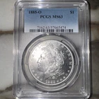 1885-O MORGAN SILVER DOLLAR GRADED BY PCGS MS-63.