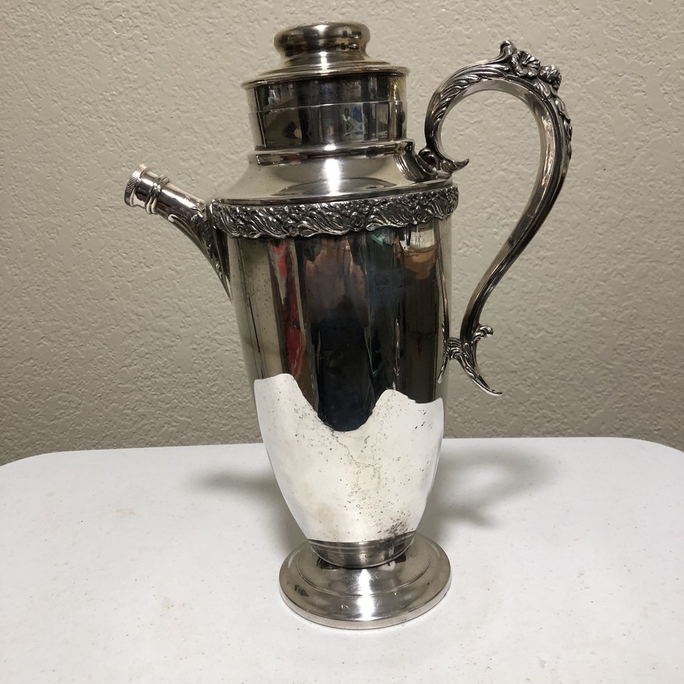 King Edward silver-plate shaker with ornate acanthus leaf and floral detailing — old-world elegance with serious vintage craft.