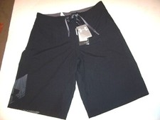 NEW Under Armour solid black boys swim suit trunks board shorts 30 swimsuit