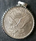 1986 Sunshine Mining 1oz Silver Round in a Bezel
