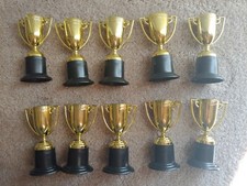 10 piece small goldtone trophies birthday party favors prizes teacher supplies