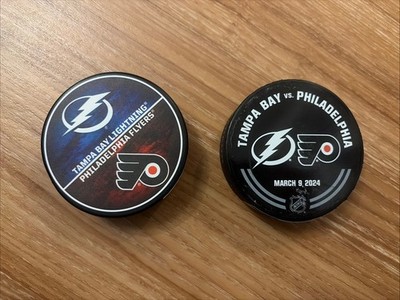 NHL TB Lightning And Philadelphia Flyers Pucks- Includes Warm Up Puck (Lot Of 2)
