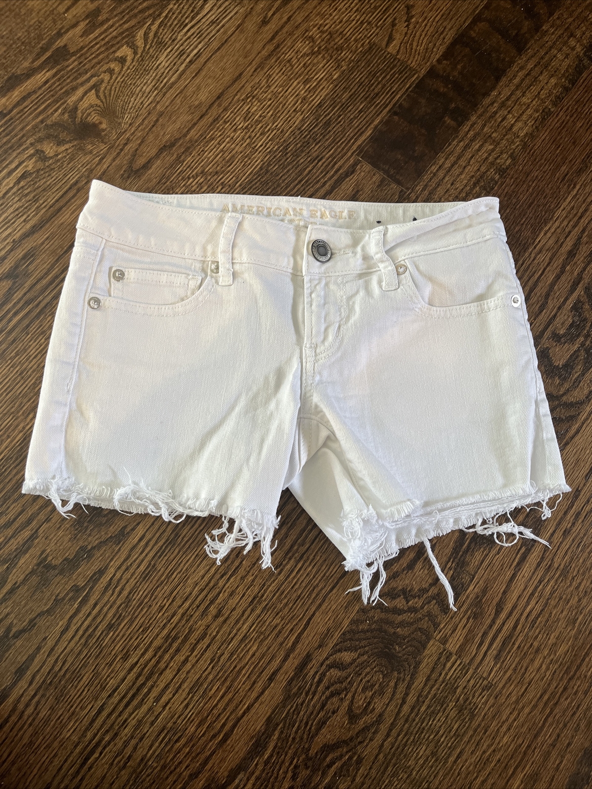 American Eagle Women's Jean Shorts Size 0/26 White Denim Stretch Raw Hem - main photo