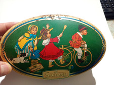 Boite publicitaire chocolat Suchard ovale de 2000.