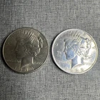 Lot Of 2 - 1923/1934 Peace Silver Dollars.  Key Date. AU/BU++