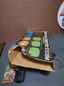 Atari 2600 Video Game Console With 2 Controllers,  Catalog & Damaged Box