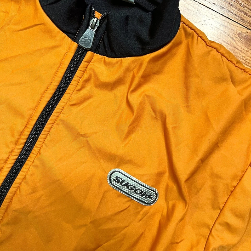 Chaqueta cortavientos Sugoi para mujer cremallera completa talla S naranja/negro manchada Foto 2 de 4
