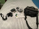 2 digital camera w/ accessories & carry bags