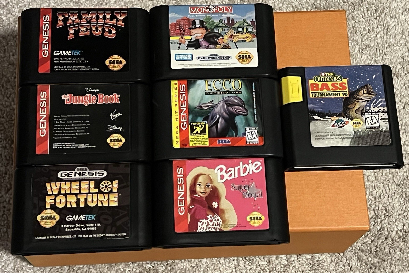 Lot Of 7 Sega Genesis Games, Monopoly, Wheel Of Fortune, Ecco, Barbie, Bass Etc