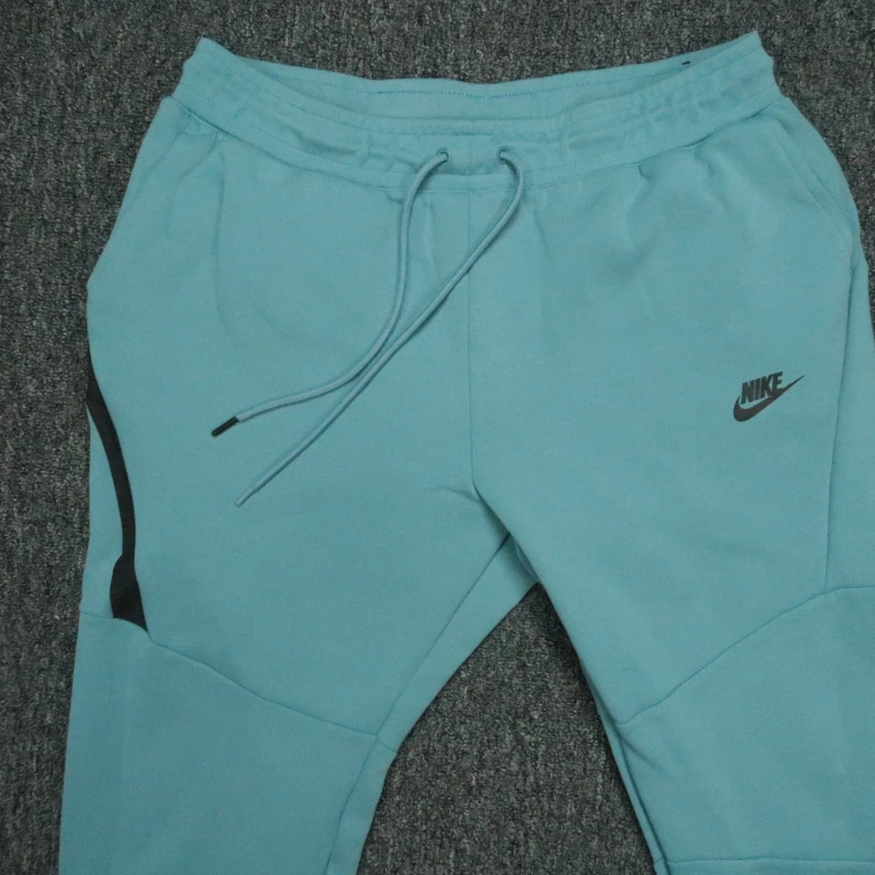 Pantalones Nike Hombres Grandes Azul Tecnología Polar Joggers Atléticos Bolsillo con Cremallera Foto 2 de 4